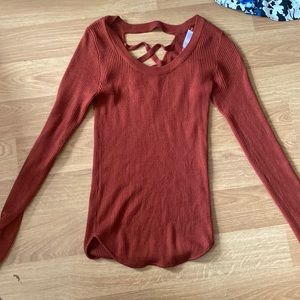 Orange long sleeve, lace up back